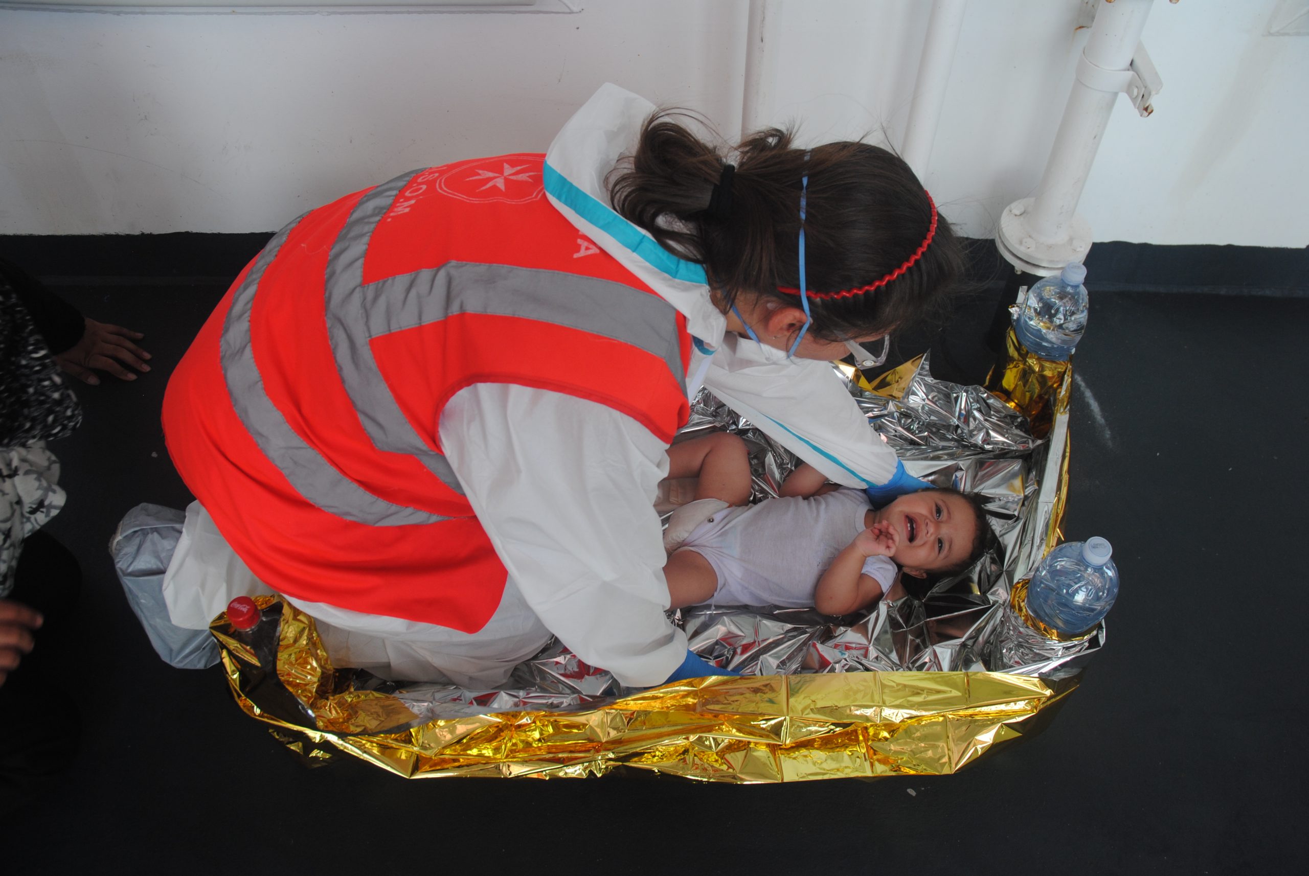 CISOM staff member rescues a child